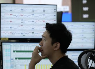 Asian shares fall, tracking Wall Street’s tumble on worries about AI stocks and interest rates