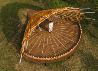 interwoven bamboo poles fan outward to form theater stage by cheng tsung feng
