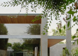 Cera Stribley shelters cottage extension with a curved timber ceiling