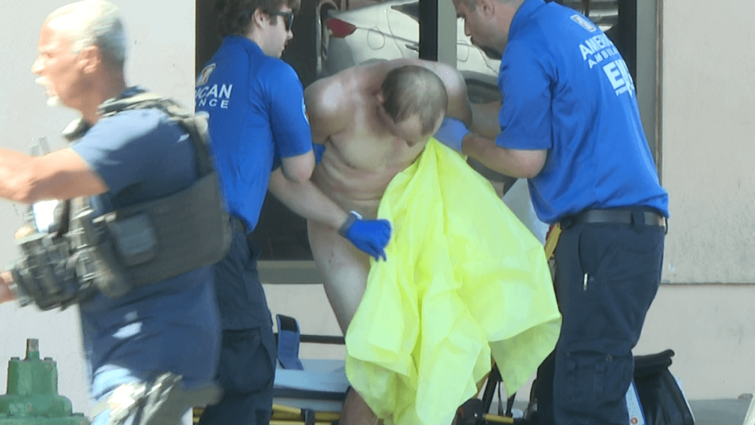 Naked man arrested after plasma patient sees eyes peeking through business wall Naked man arrested after plasma patient sees eyes peeking through business wall